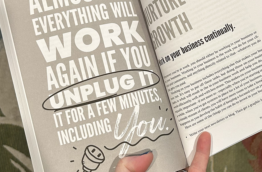 A hand holds open a book showing a bold typographic spread with the quote "Almost everything will work again if you unplug it for a few minutes, including you," with "unplug it" circled for emphasis, alongside a chapter page titled "Nurture Growth."